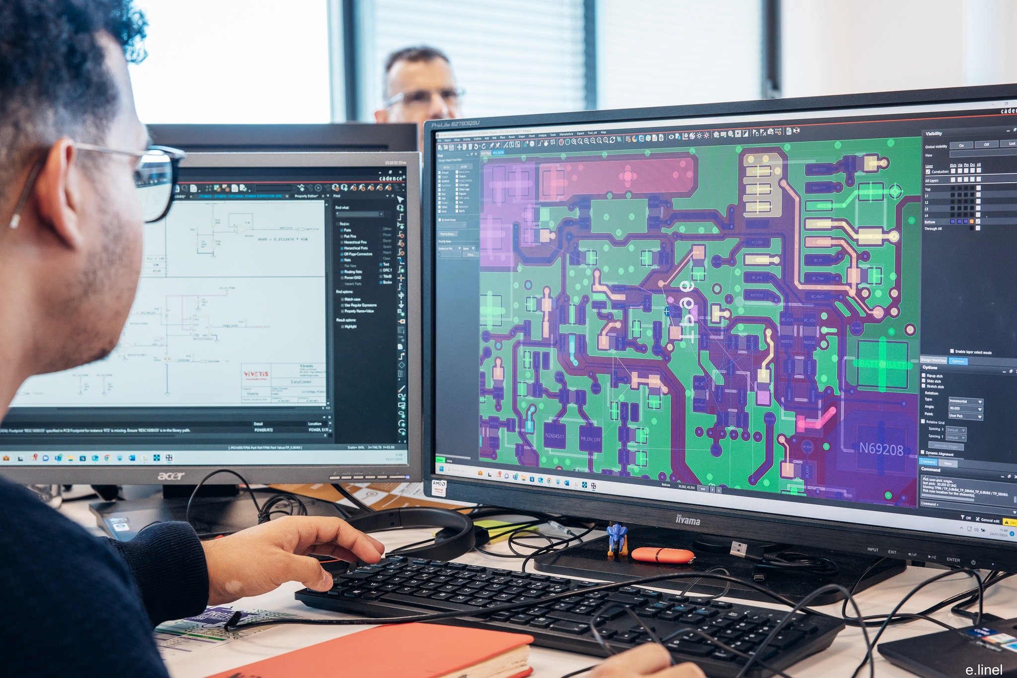 Electronics design team working on PCB circuits